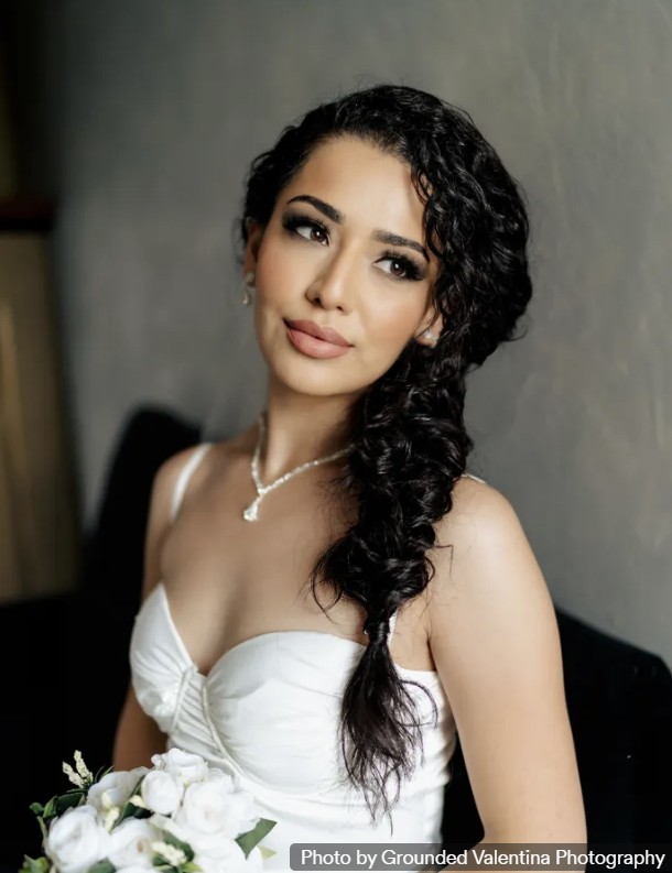 Bridal portrait with a braided side style and soft glam